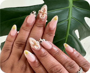 floral nail art design with pink and white flowers at J'Adore Nails Cherry Hill